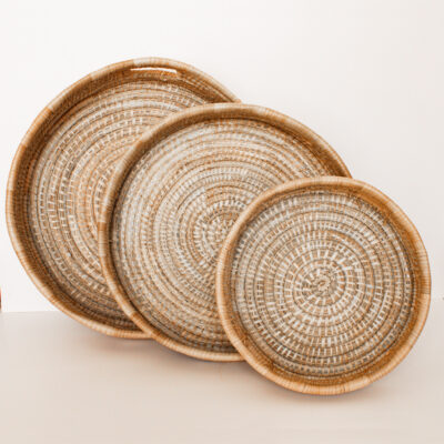 variety of woven reed baskets on a white background